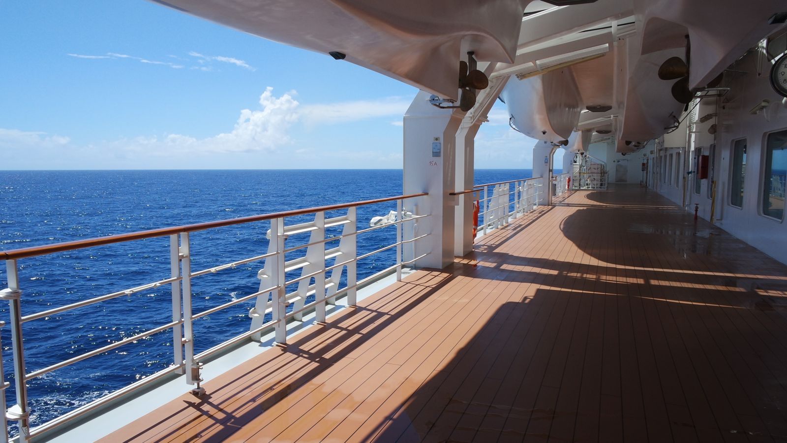 Cruise ship deck overlooking blue ocean